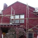 scaffolding on a brick home